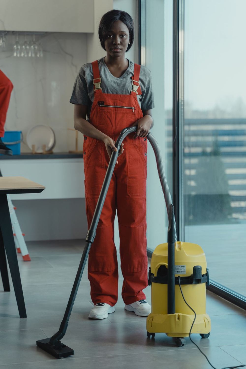 Commercial cleaner vacuuming an office floor